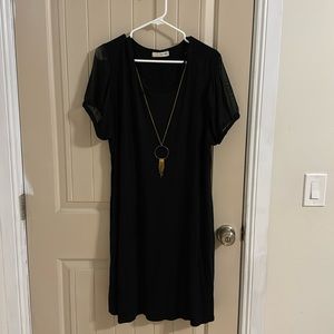 Black short sleeve dress with gold necklace